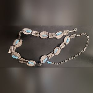 Blue and silver belt. 26 inches with a 13 inch extension